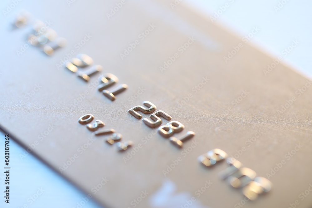 One credit card on light background, macro view One credit card on light background, macro view