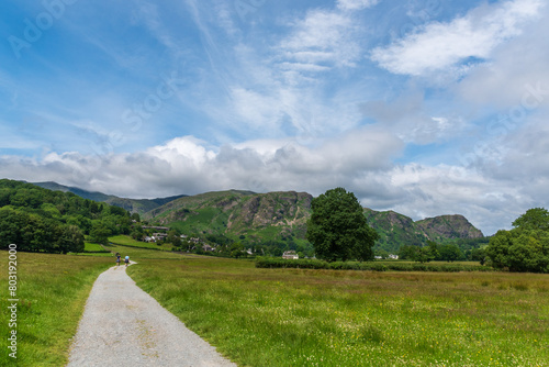 A beautiful summer sky over the town of Coniston in the Lake District, England with Yewdale Fell in the distance.