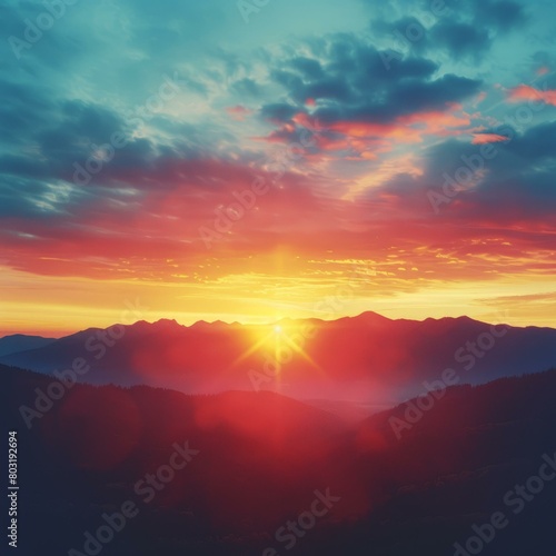 Amazing mountain landscape during sunset with vibrant red orange and blue sky