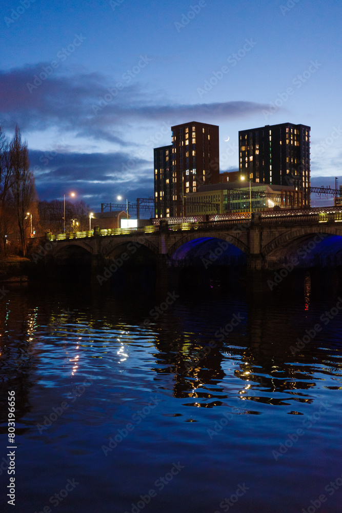 Glasgow Scotland: 11th Feb 2024: Blue hour dusk scene Caledonian Railway Bridge with river refelction at night. Glasgow Central railway