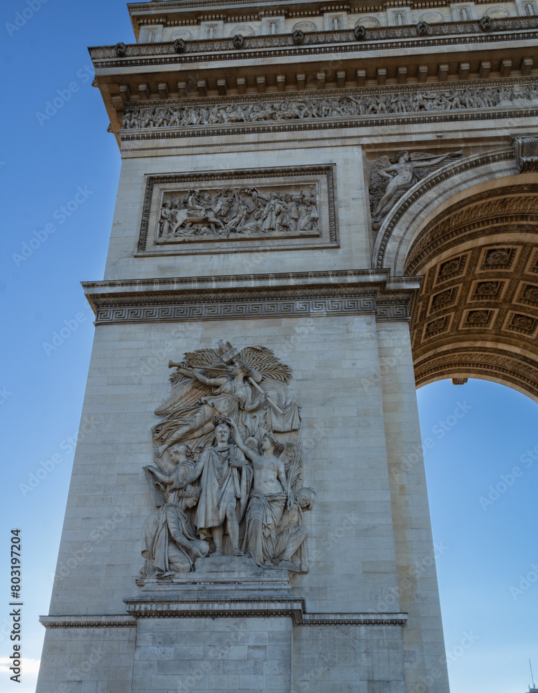 Fototapeta premium Arc de Triomphe de l'Étoile, located on the Charles de Gaulle square, and at the western end of the Champs Elysées avenue. Paris, France