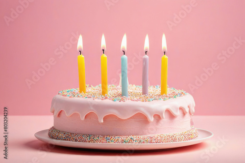 birthday cake with 5 five candles on pastel pink background