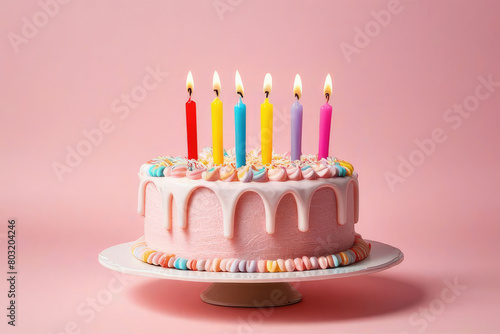 birthday cake with 6 six candles on pastel pink background