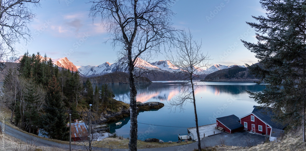 panoramic shot of cabin by the Holandsfjord in Nordland county.In the background is the Svartisen glacier, Norway's second largest glacier