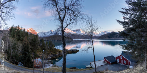Obraz na płótnie panoramic shot of cabin by the Holandsfjord in Nordland county.In the background is the Svartisen glacier, Norway's second largest glacier w salonie