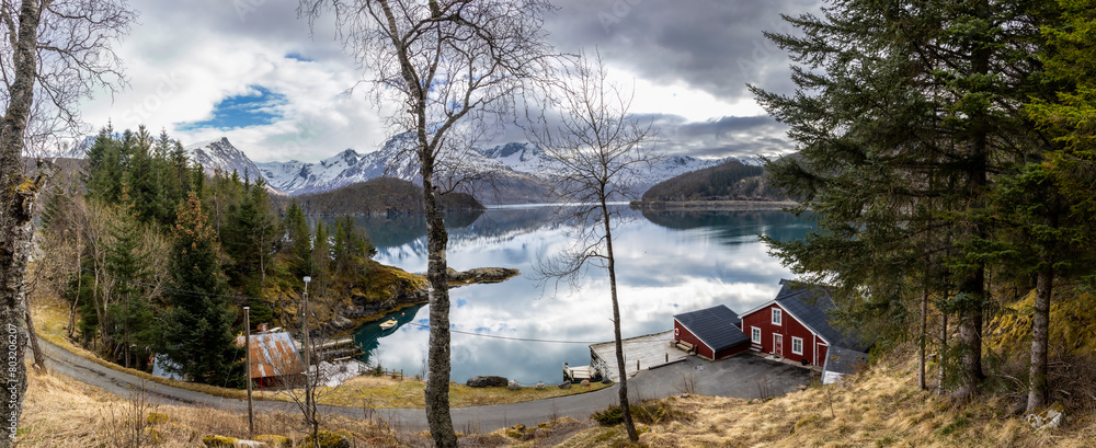 panoramic shot of cabin by the Holandsfjord in Nordland county.In the background is the Svartisen glacier, Norway's second largest glacier