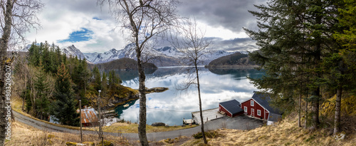 Obraz na płótnie panoramic shot of cabin by the Holandsfjord in Nordland county.In the background is the Svartisen glacier, Norway's second largest glacier w salonie