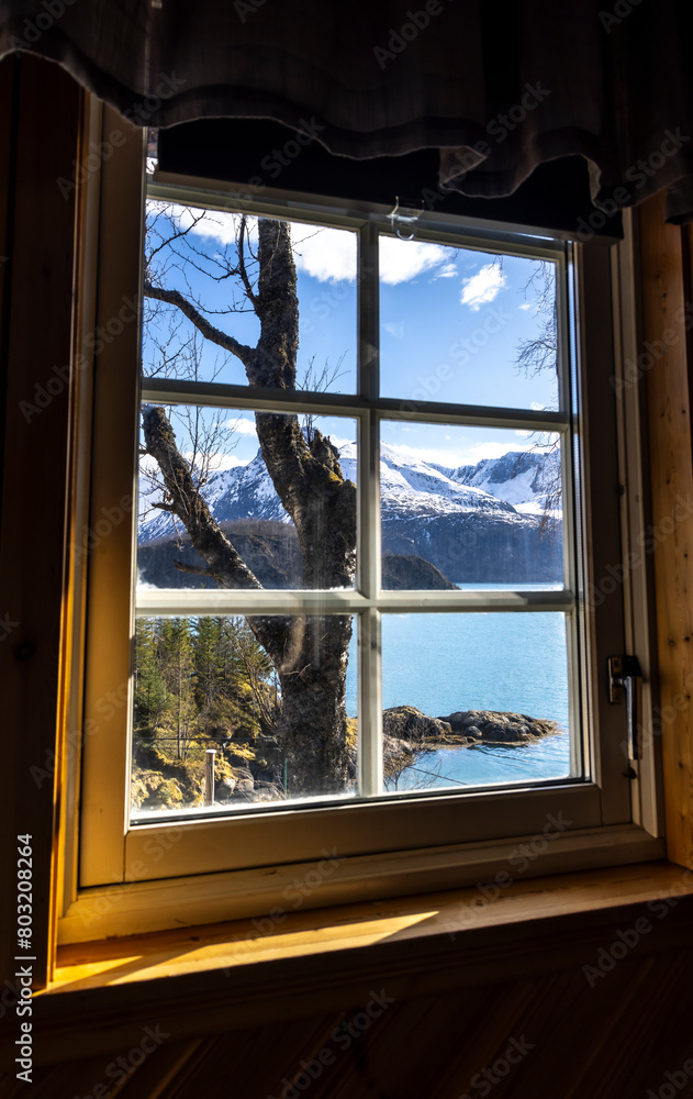 View from a window to the Holandsfjorden and Svartisen glacier in Nordland County, Norway