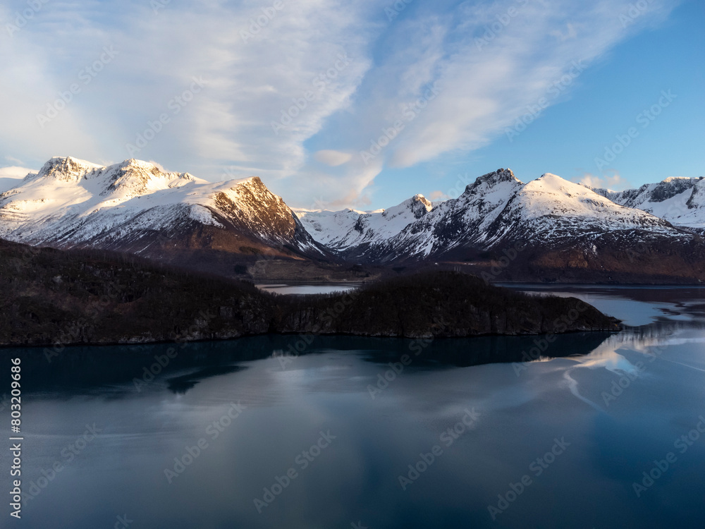 Panoramic drone view of Holandsfjord and Nordfjord in Nordland county. In the background is the Svartisen glacier, Norway's second largest glacier
