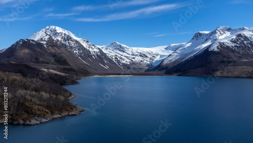 Panoramic drone view of Holandsfjord and Nordfjord in Nordland county. In the background is the Svartisen glacier, Norway's second largest glacier