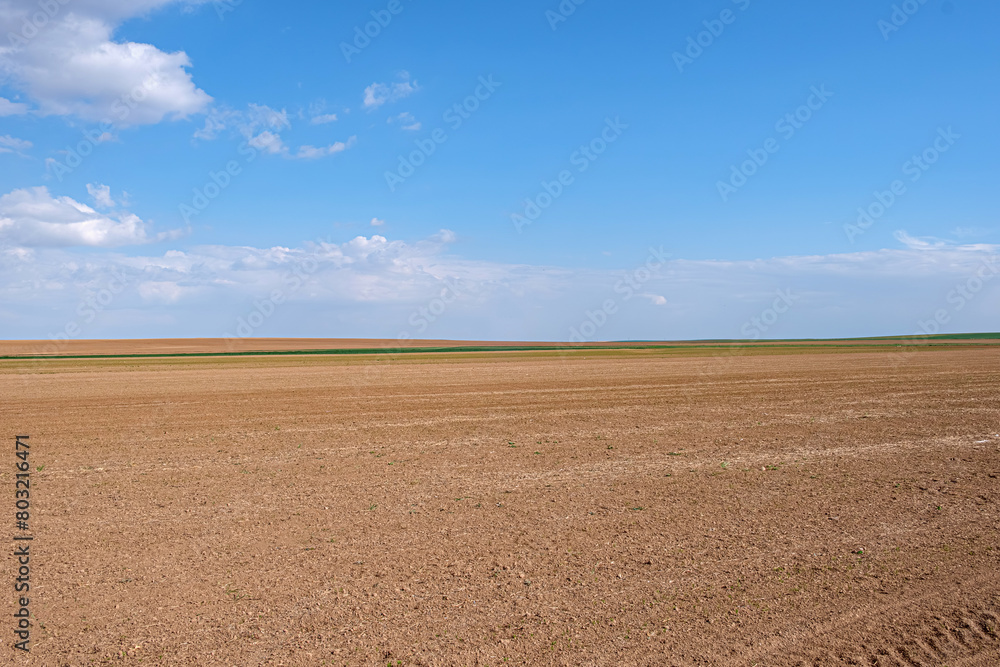 Fallow land, vast farmland in the vast plain. It has not yet been cultivated. Minimal farmland photo. Fallow land, vast farmland in the vast plain. It has not yet been cultivated. Minimal farmland photo.