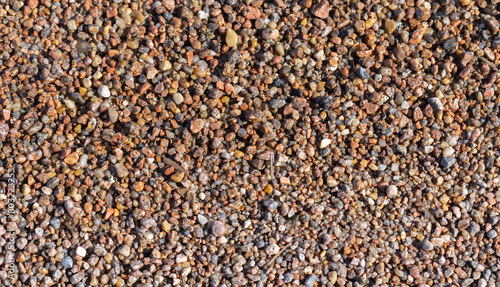 Coarse wet sand on the shore of the Baltic Sea, top view Coarse wet sand on the shore of the Baltic Sea, top view