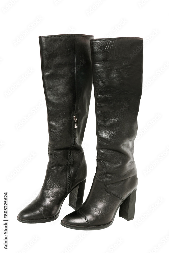 A pair of black elegant female boots or woman shoes isolated on a white background. Leather boots. Clipping path.