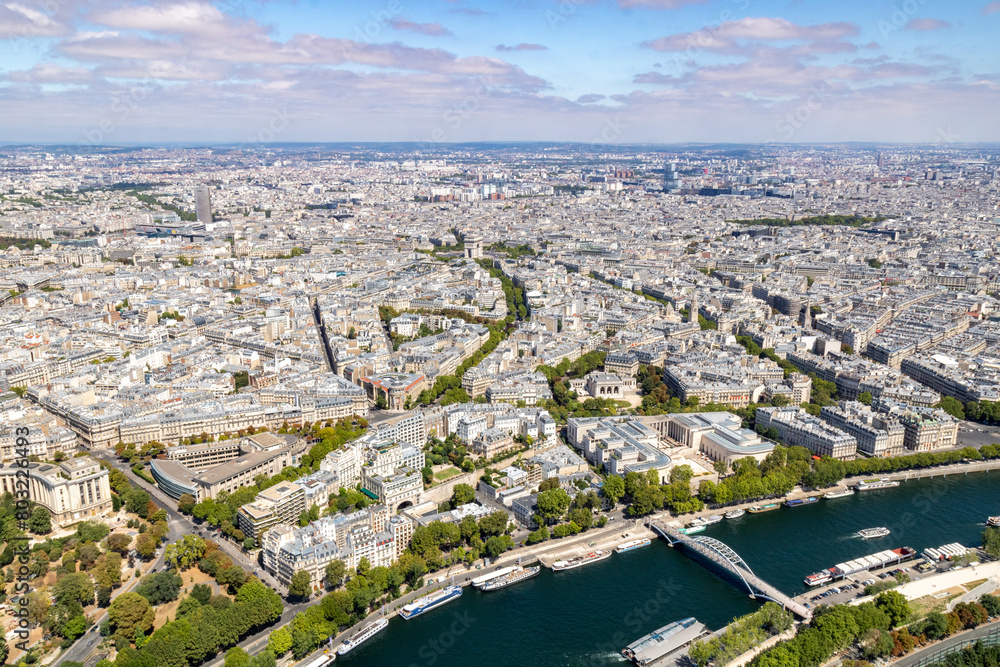 Panoramic view of the roofs of the buildings around the Tour Eiffel and Seine river, Paris, France.