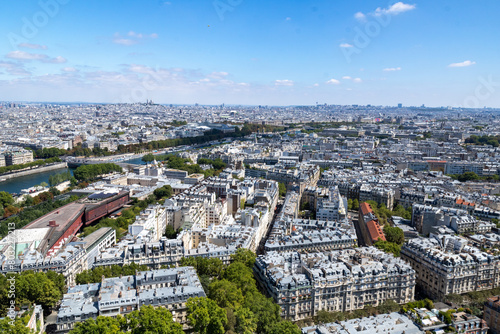 Panoramic view of the roofs of the buildings around the Tour Eiffel and Seine river, Paris, France. © MARIA ALBI