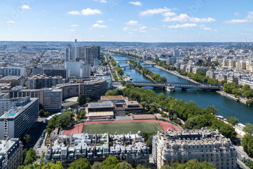 Panoramic view of Émile Anthoine Stadium, the roofs of the buildings around the Tour Eiffel and Seine river, Paris, France.