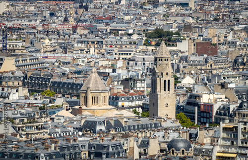 Panoramic view of Église Saint-Pierre-de-Chaillot, the roofs of the buildings around the Tour Eiffel and Seine river, Paris, France.