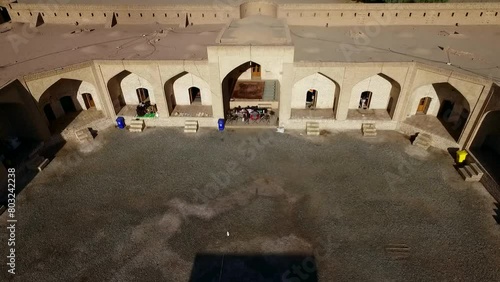 Historic structure of a caravanserai from Safavid era in the deserts of Iran. High resolution and quality aerial footage. photo