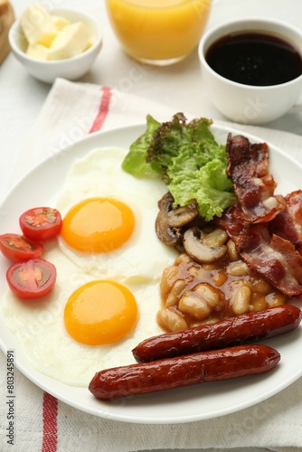 Delicious breakfast with sunny side up eggs on white table, closeup