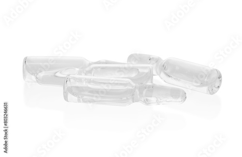 Glass ampoules with liquid isolated on white