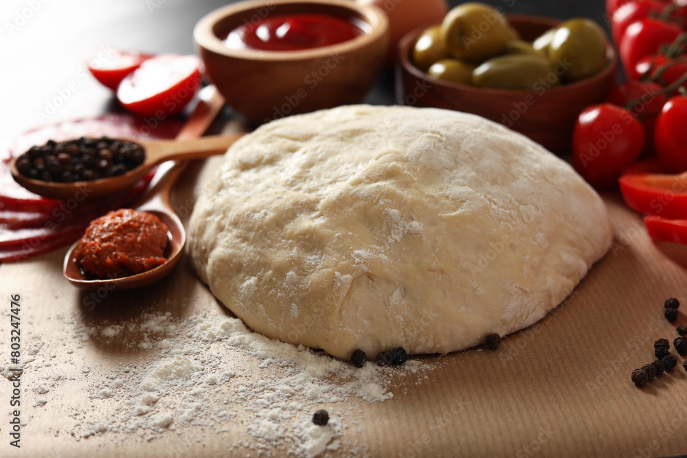 Fototapeta premium Pizza dough and products on table, closeup