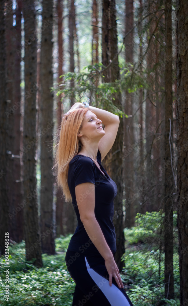 Portrait of beauty young caucasian woman in forest. Model pose in nature background Portrait of beauty young caucasian woman in forest. Model pose in nature background