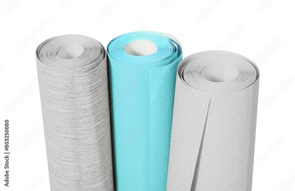 Different colorful wallpaper rolls isolated on white