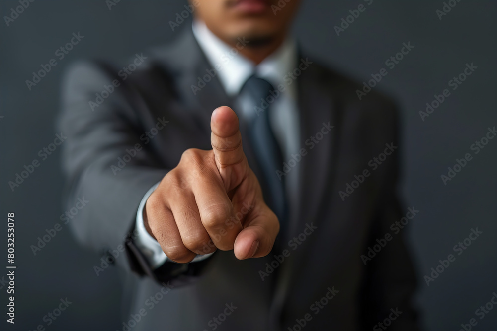 Businessman finger point to empty space, front view Businessman finger point to empty space, front view