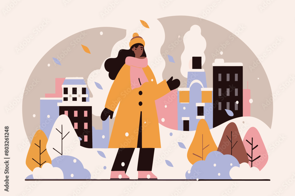 Naklejka premium A woman strolls amidst snow-covered trees and buildings