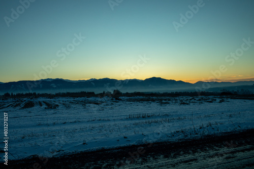 Sunset over mountains in winter season. © Munka