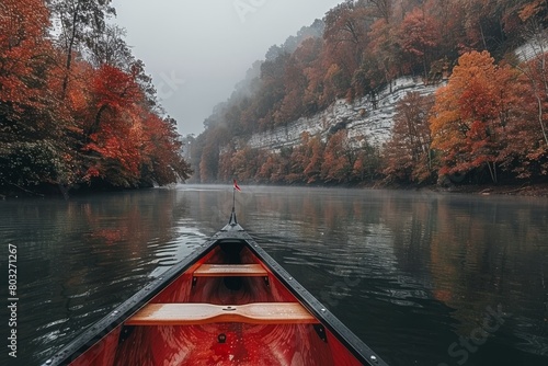 Boat Traveling Down River in Fall