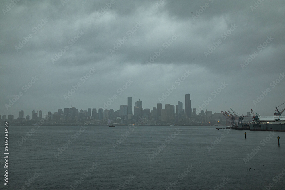 Fototapeta premium City skyline seen from harbor with many tall buildings in the background
