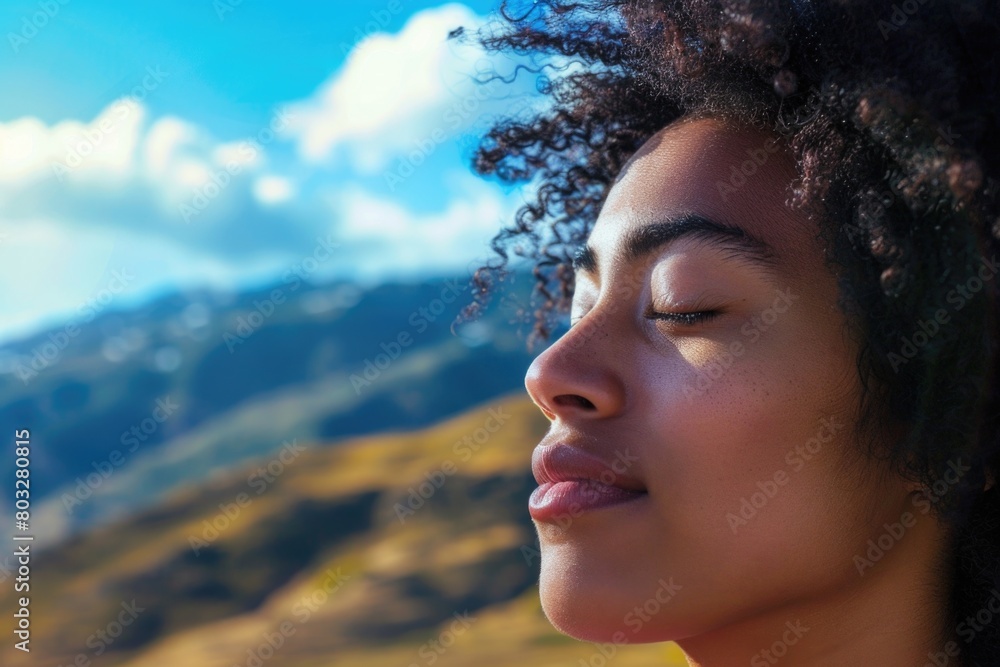 A woman with her eyes closed, surrounded by a serene mountain backdrop. Ideal for wellness and relaxation concepts A woman with her eyes closed, surrounded by a serene mountain backdrop. Ideal for wellness and relaxation concepts