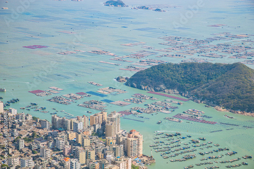 High angle view of the bay and fishing village on the top of the flag crown of Lianjiang County, Fujian Province photo