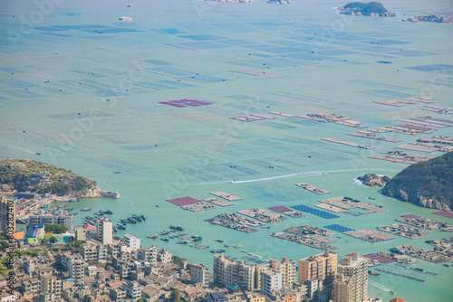 High angle view of the bay and fishing village on the top of the flag crown of Lianjiang County, Fujian Province photo