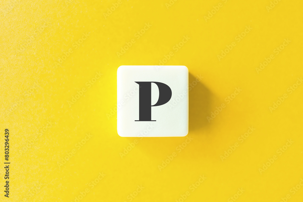 Capital Letter P. Text on Block Letter Tiles against Yellow Background. Capital Letter P. Text on Block Letter Tiles against Yellow Background.
