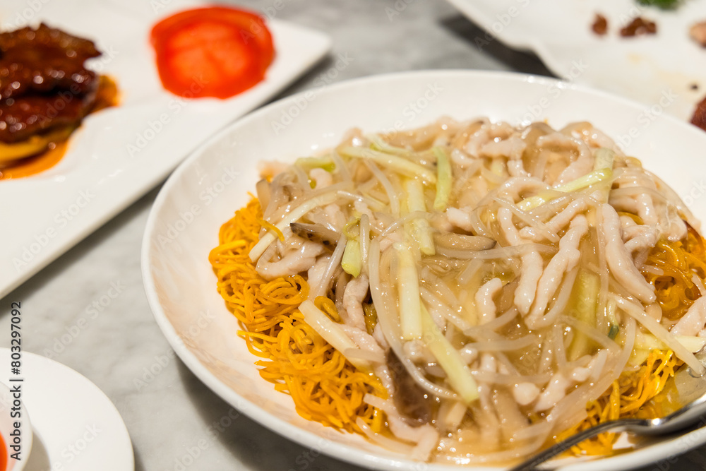 Deep fried noodles with vegetable in cantonese restaurant Deep fried noodles with vegetable in cantonese restaurant