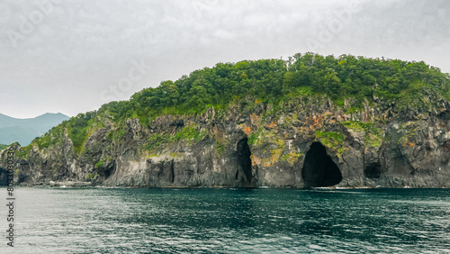 Quadro em tela A series of eroded sea caves, including the Kunne-Poru (Black Caves), located on the southern coast of the Iwaobetsu River in Shiretoko Peninsula, Hokkaido of Japan