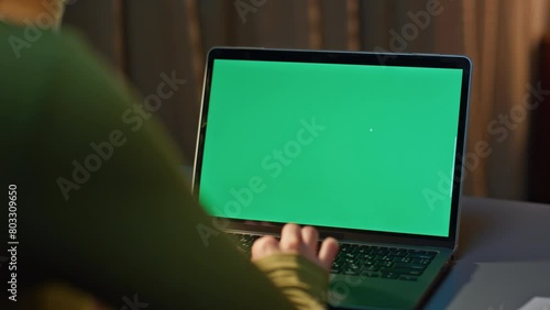 Student surfing green screen laptop internet night home close up. Woman working