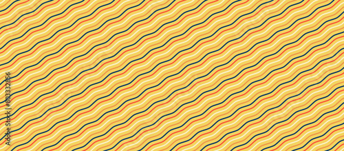 The image is of a repeating pattern of yellow and brown curved lines.