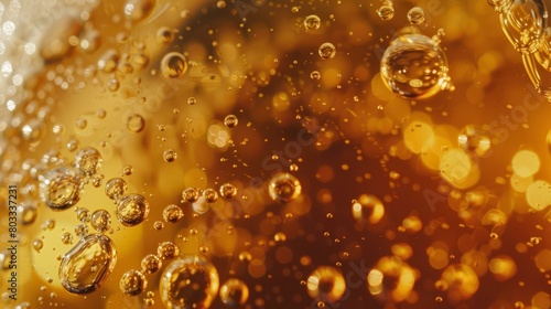 Close-up of bubbles in a glass of amber liquid