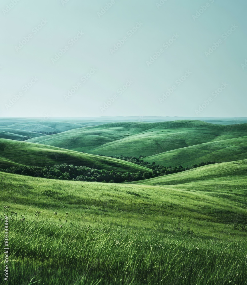 Picturesque green rolling hills under the clear blue sky