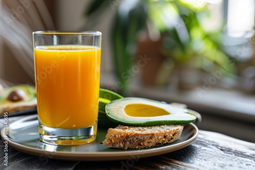 A refreshing glass of orange juice paired with whole grain avocado toast.