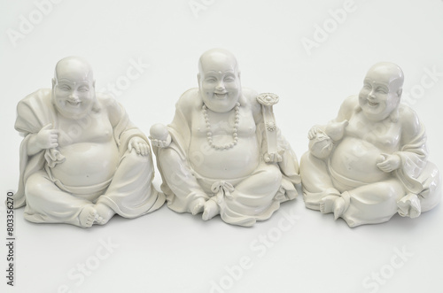 Still life with three white Buddhas