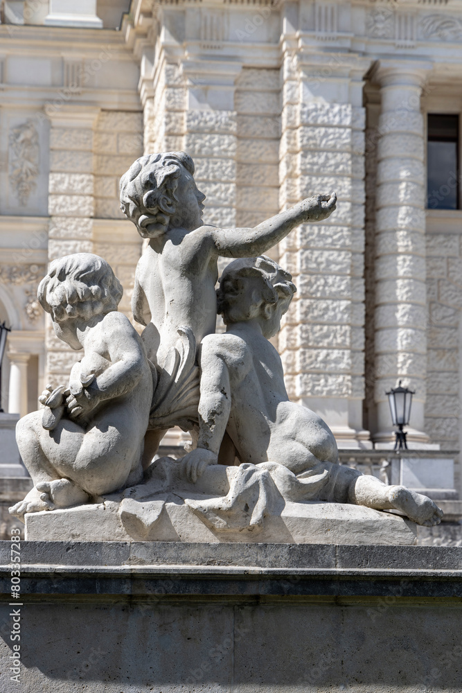 Stone figures of children at  entrance to baroque Hofburg palace, Neue Burg, Vienna, Austria
