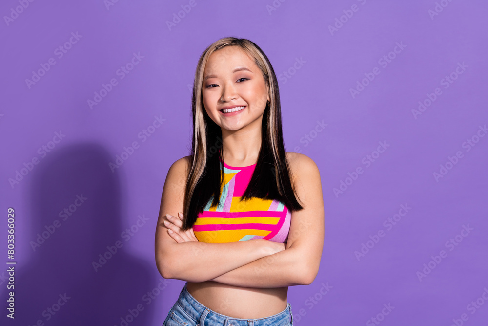Photo of lovely adorable girl wear stylish clothes crossed arms isolated on purple color background Photo of lovely adorable girl wear stylish clothes crossed arms isolated on purple color background