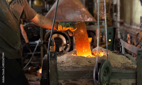 Ferrous metal billet is melted in an induction furnace closeup