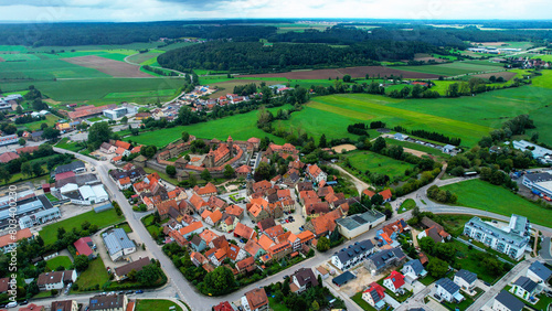 Aerial view around the old town of the city Lichtenau in Germany on a cloudy day in Spring