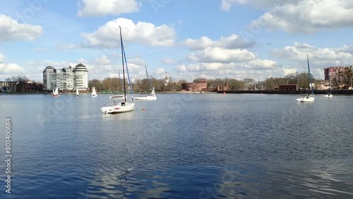 sailing boats on the city center lake. sailing boats on a city center lake in Europe, Kaliningrad, Russia, 6 April 2024, central park. lake Verkhnee photo