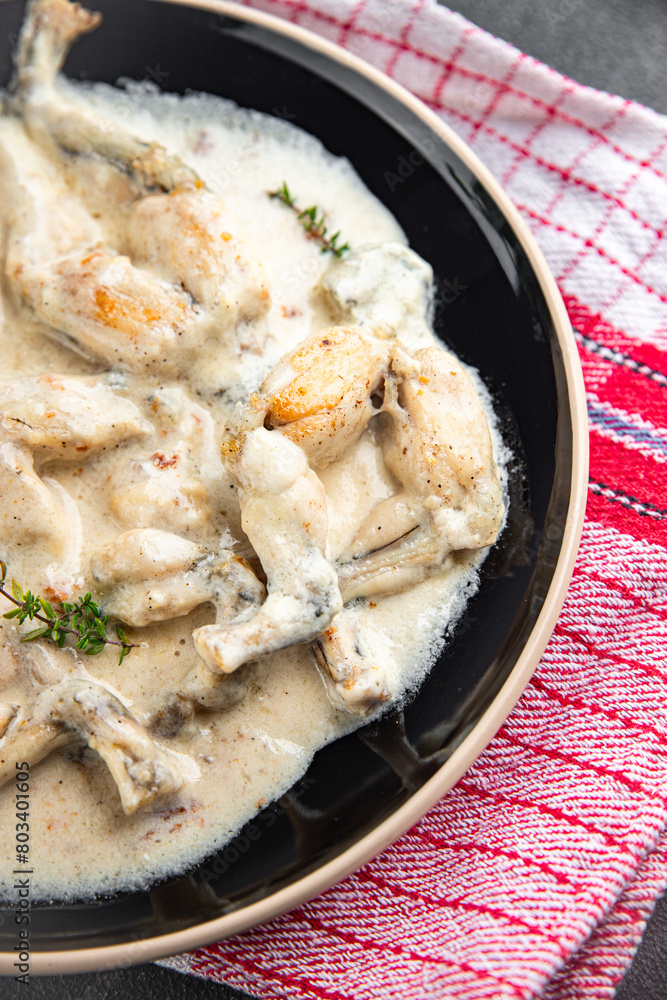 frog legs food French cuisine second course shriveled Cooking appetizer meal food snack on the table copy space food background frog legs food French cuisine second course shriveled Cooking appetizer meal food snack on the table copy space food background